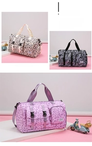 Detail view of large travel bags in leopard and zebra prints with adjustable straps