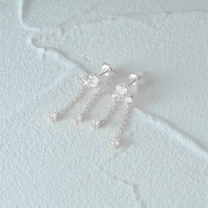 Close-up of elegant S925 silver tassel earrings with sparkling diamond-like stones