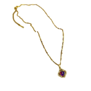Titanium steel gold necklace with a four-leaf clover pendant and multifaceted gemstone