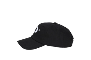 Detailed close-up of white letter P embroidery on a black cotton baseball cap