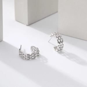 Detail shot of silver S925 sterling silver twisted chain texture C-shape hoop earrings
