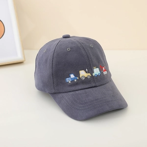 Close-up of colorful construction truck embroidery on a dark grey kids' baseball cap