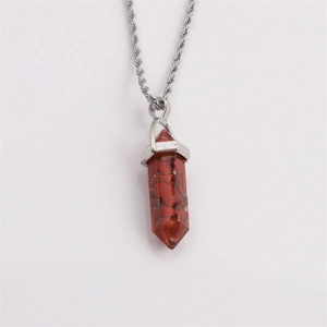 Hexagonal red jasper bullet pendant necklace with silver twisted chain on white background