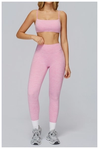 Close-up of pink marl yoga set with racerback sports bra and high-waisted leggings