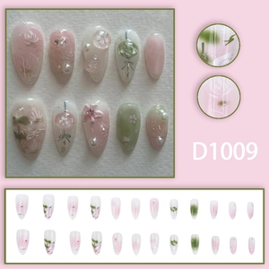 Pink and green gradient press-on nails with 3D floral relief and pearl accents