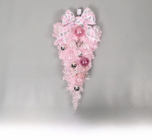 Detail of pink Christmas upside-down tree with pink bows, glitter balls, and clear ornaments
