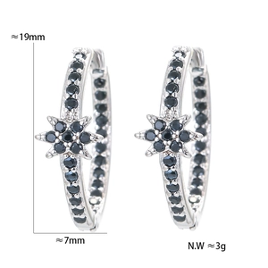 Detailed view of star-shaped silver earring with black zircons, 19mm in height
