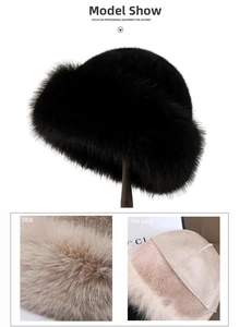 Detailed texture of thick plush faux fur bucket hat in black and cream white colors