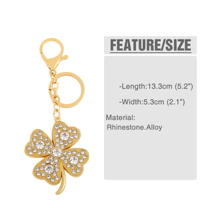 Detailed view of rhinestone clover keychain with measurements of 13.3cm long and 5.3cm wide