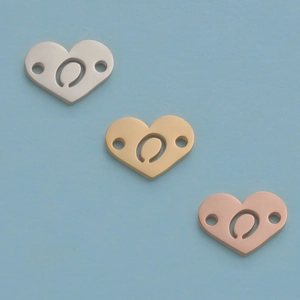 Macro view of 12mm mirror stainless steel heart pendants in silver, gold and rose gold