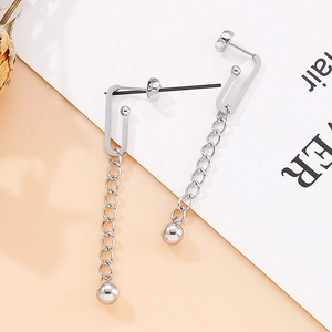 Detail of silver stainless steel drop earrings with tassel chains and round beads