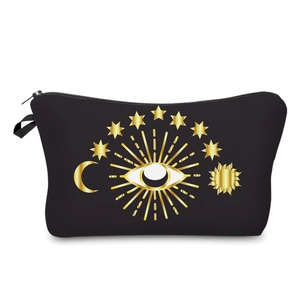 Black cosmetic bag with golden evil eye and celestial patterns on white background