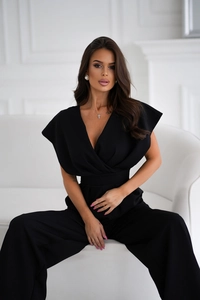 Detail of elegant black deep V-neck sleeveless jumpsuit with wide leg and high waist design