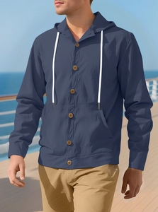 Detail of dark blue hooded shirt featuring white drawstrings and wooden texture buttons