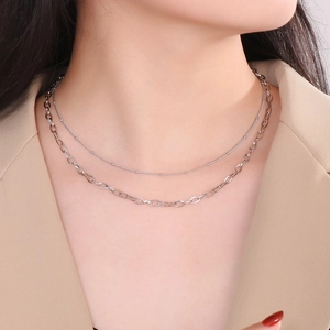 Silver double layer oval link necklace on model showing elegant minimalist style