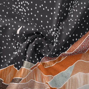 Close-up of soft tapestry fabric with celestial moon star pattern and earth tone hills