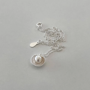 Detailed macro view of S925 sterling silver stamp on the shell pearl necklace clasp