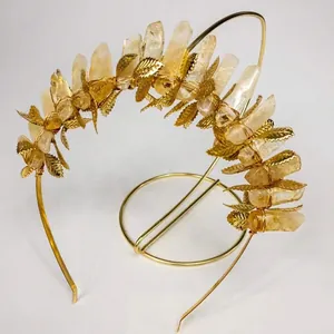 Detailed macro view of raw natural amethyst stones and golden leaf charms on the crown headband