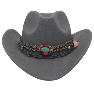 Detail of grey felt cowboy hat featuring bohemian beaded band and turquoise gemstone