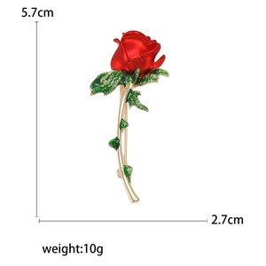 Fashionable red rose enamel brooch with green leaves and gold stem in a 5.7cm size