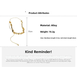 Detail of golden wheat-shaped leaf necklace showing adjustable chain length and dimensions