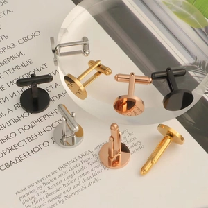 Macro shot of mirror-finish round metal cufflinks in gold, silver, rose gold, and black