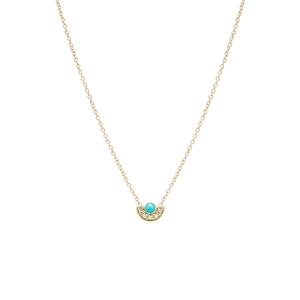 Macro shot of S925 silver gold-plated turquoise fan pendant necklace with white zircons