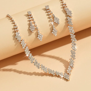 Elegant gold necklace and earring jewelry set with sparkling rhinestones for party