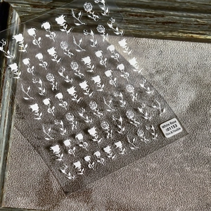 Elegant white rose nail art stickers with thin, durable texture for manicures