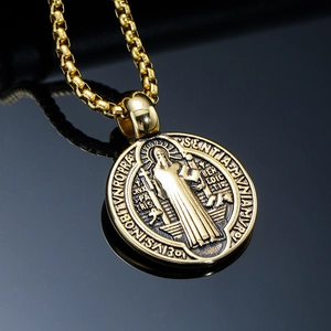Golden Saint Benedict Medal pendant in stainless steel with detailed religious engraving