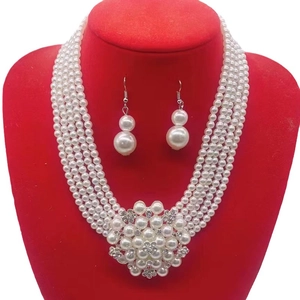 Elegant multi-layer pearl necklace and earring set with floral rhinestone centerpiece