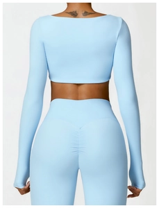 Close-up of light blue high-waist yoga leggings featuring ruched butt-lifting detail