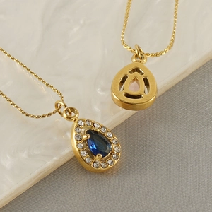 18K gold teardrop necklace featuring blue zircon pendant and elegant double layered chain