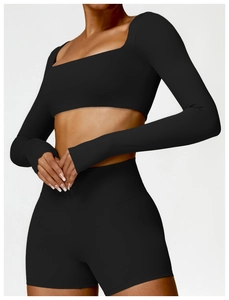 Detail of square neck black long sleeve crop top with high waist shorts for fitness