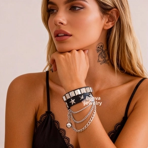 Close-up of punk PU leather multi-layer bracelet with metal studs, stars and chains