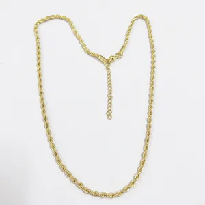 Close-up of golden rope chain necklace showing twisted texture and lobster clasp detail
