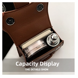 Detailed interior of brown pebbled leather mini bag showing storage capacity and double magnets