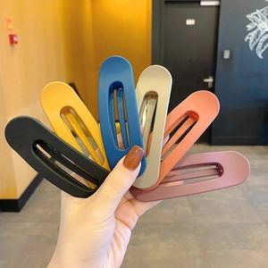 Set of six large matte finish hair clips in vibrant colors including blue and yellow