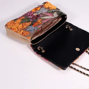 Ethnic embroidered sequin shoulder bag with floral patterns and gold chain strap