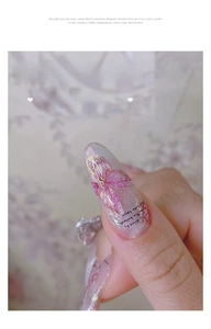Detail of long oval nails with pink watercolor butterfly 3D relief nail art stickers