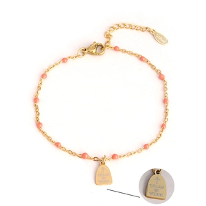 Golden stainless steel bracelet with orange beads and tombstone cross charm