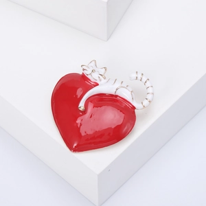Creative white enamel cat and red heart brooch with gold trim on geometric stands