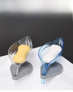 Leaf-shaped soap holder with suction cup base and self-draining leaf vein structure