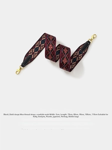 Detail of vintage geometric woven bag strap with 5cm width and golden metal clasps
