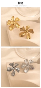 Detail showing the intricate floral texture of gold and silver flower stud earrings