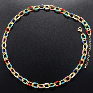 Macro detail of colorful enamel links on a golden chain with lobster clasp closure