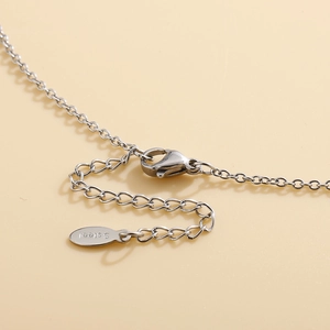 Polished stainless steel necklace with Hamsa Hand palm pendant and sparkling crystals