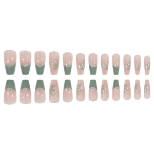 Elegant ballerina press-on nails with green French tips, white flowers and pearl accents