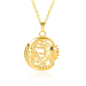 Macro view of golden sun and moon cutout pendant on a delicate stainless steel chain