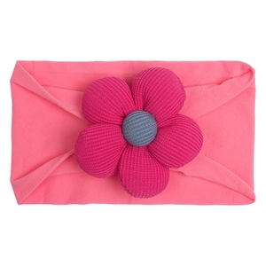 Detail of pink nylon elastic baby headband with a 3D knit magenta flower and grey center